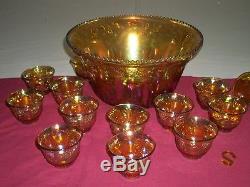 Carnival Punch Bowl & 12 Cups. Amber carnival glass with beautiful reflective c
