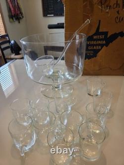 Complete vintage West Virginia Glass punch bowl set with original box. Has 14